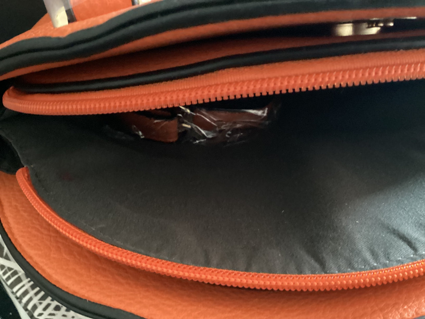Soft orange leather pockt book includes wallet and strap